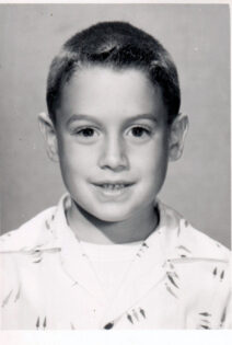 Gene Brody posing for school photo about age 9.